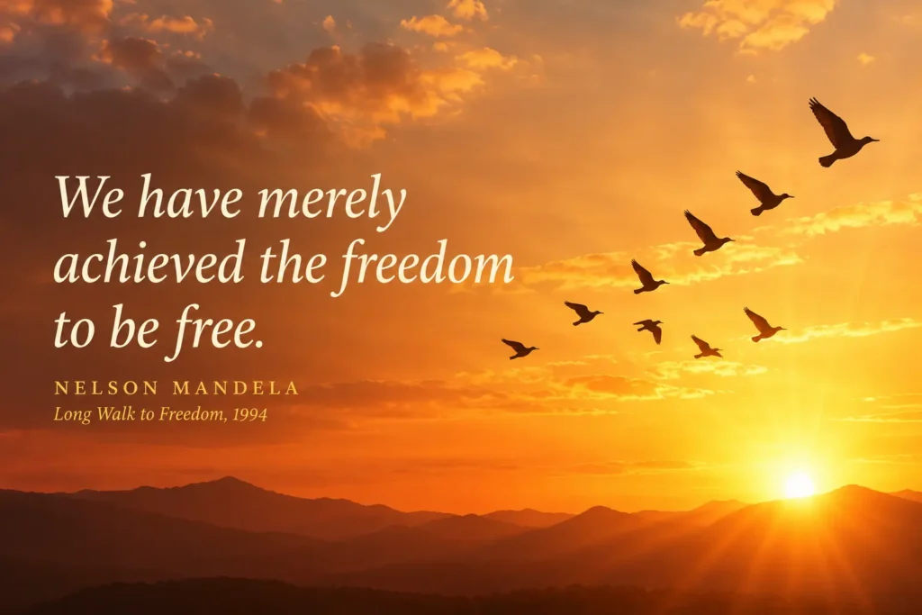 Mandela quote: we have merely achieved the freedom to be free, with birds flying across an orange sunrise